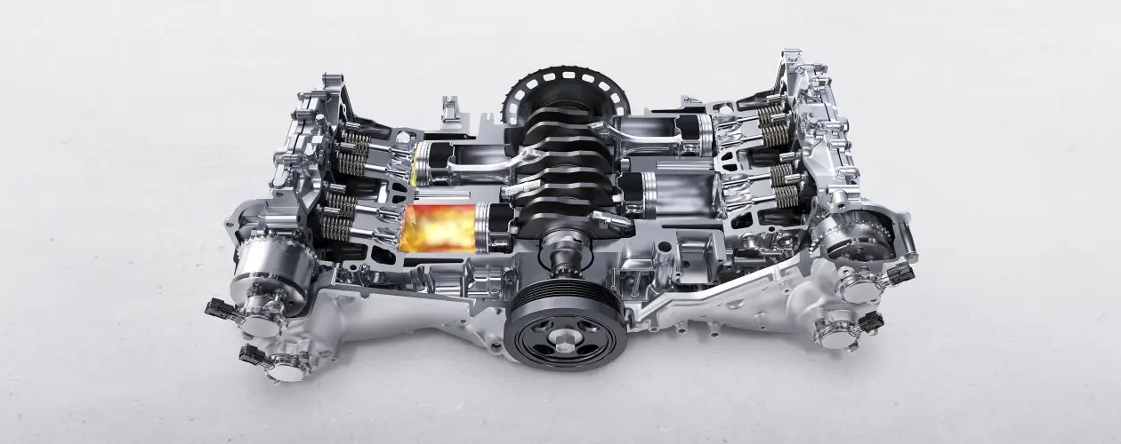 Motor bóxer Subaru sobre fondo blanco.